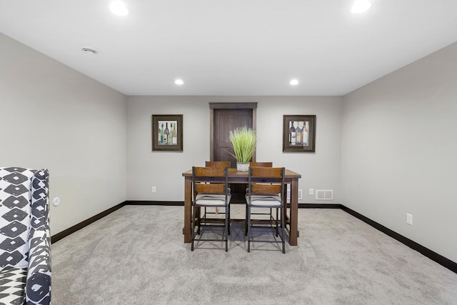 dining area with light colored carpet