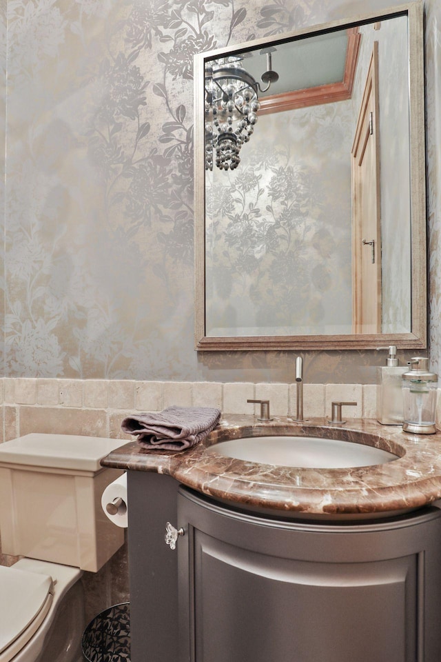 bathroom with vanity and toilet