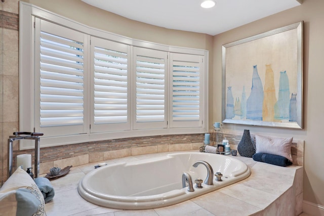 bathroom featuring a relaxing tiled tub