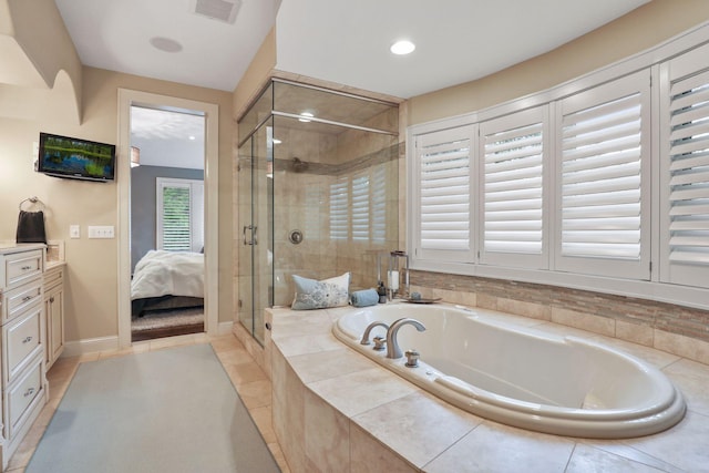 bathroom with independent shower and bath and vanity