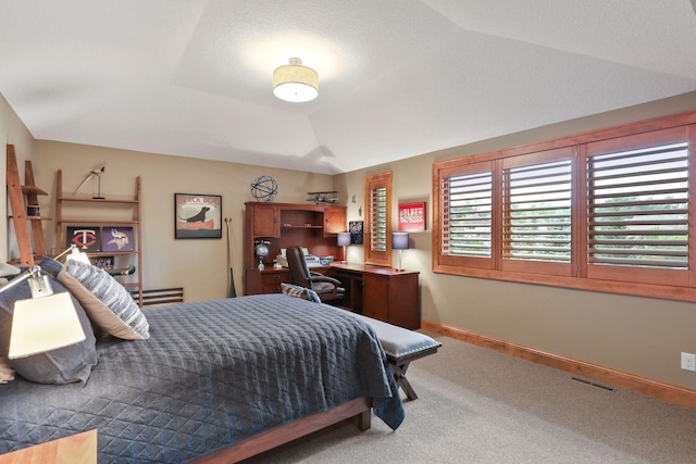 carpeted bedroom featuring vaulted ceiling