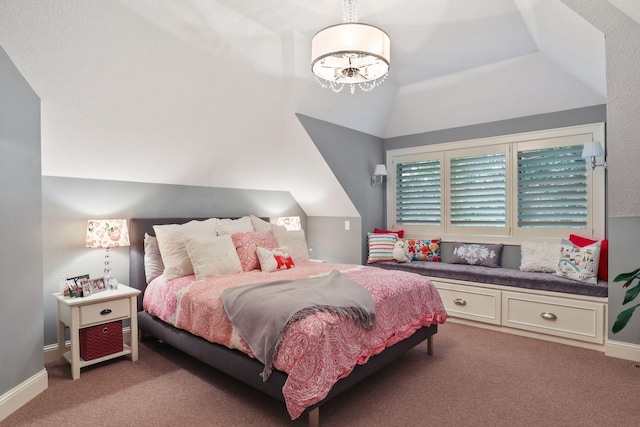 carpeted bedroom with lofted ceiling and a notable chandelier