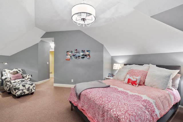 bedroom featuring vaulted ceiling and carpet floors