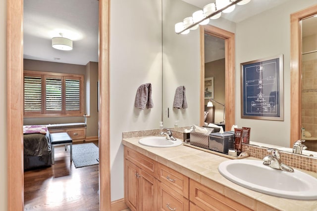 bathroom featuring vanity and wood-type flooring