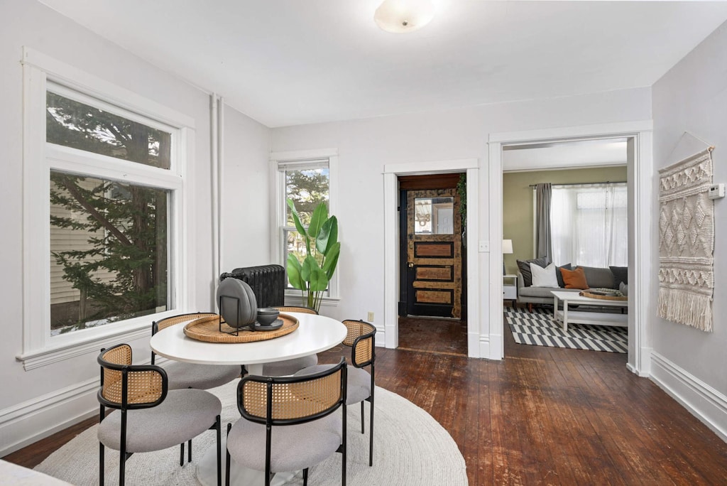 dining area featuring dark hardwood / wood-style floors