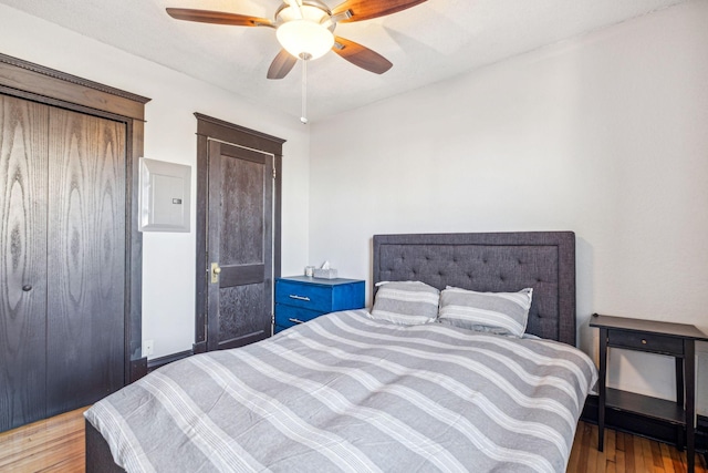 bedroom featuring ceiling fan and light hardwood / wood-style flooring