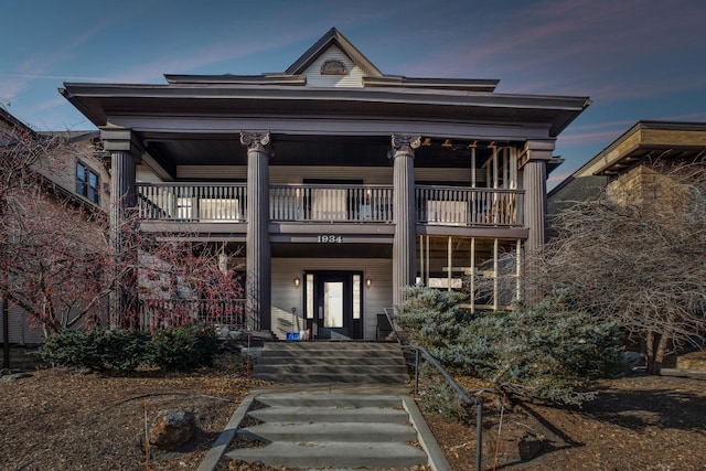 view of front of house with a balcony