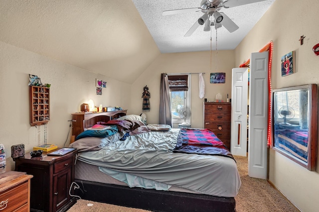 carpeted bedroom featuring a textured ceiling, ceiling fan, and vaulted ceiling