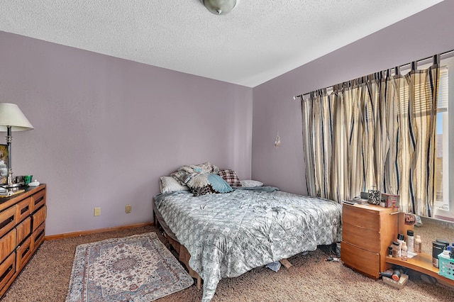 carpeted bedroom featuring a textured ceiling