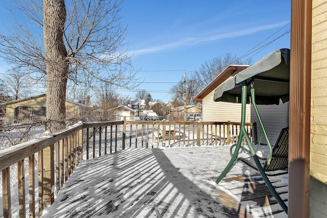 view of snow covered deck