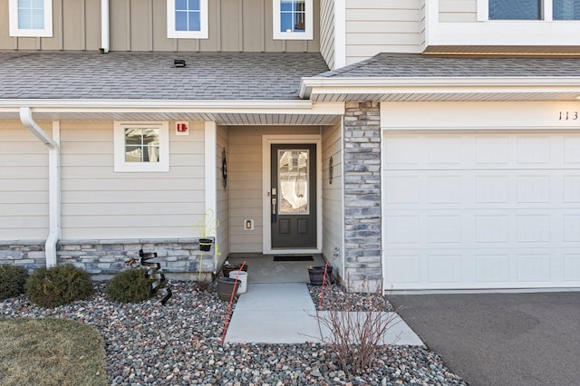 doorway to property featuring a garage