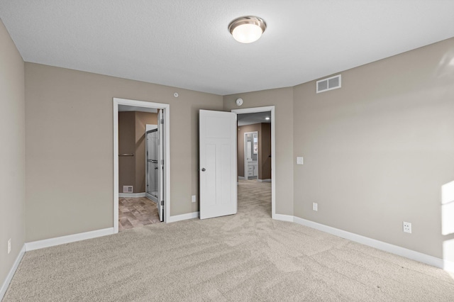 unfurnished bedroom with light carpet