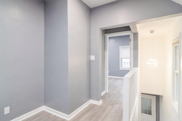 corridor featuring light hardwood / wood-style floors