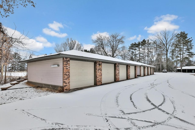 view of snow covered garage