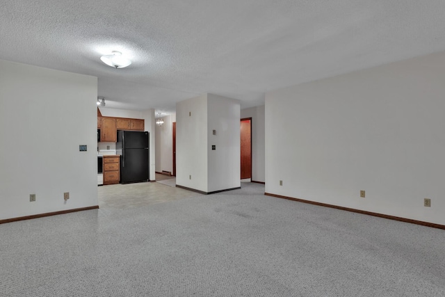 unfurnished living room featuring a textured ceiling