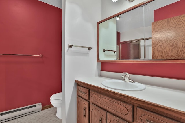 bathroom with toilet, a baseboard radiator, and vanity