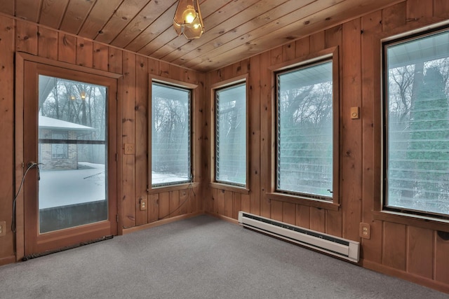 entryway featuring wood ceiling, carpet floors, plenty of natural light, and a baseboard heating unit