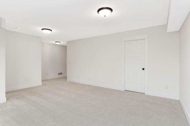 spare room with light carpet