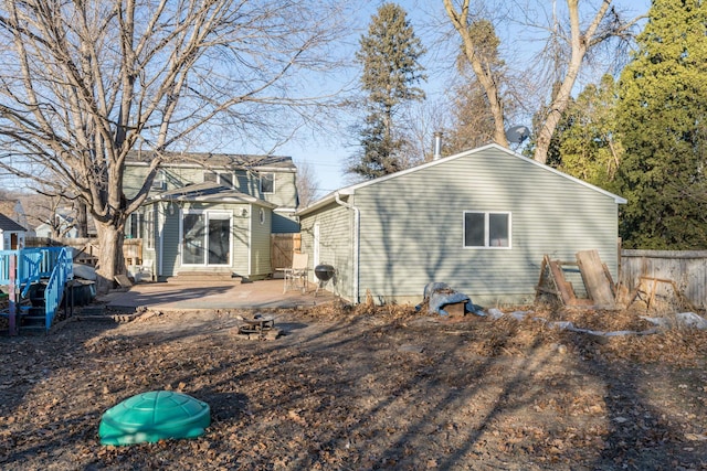 rear view of property featuring a patio