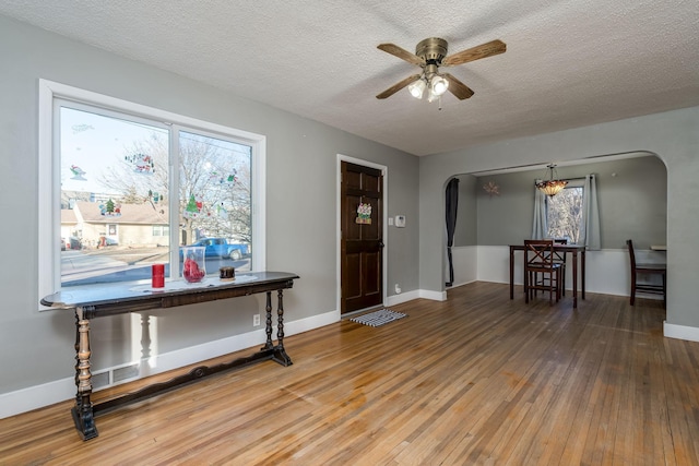 foyer featuring hardwood / wood-style floors, a textured ceiling, and ceiling fan