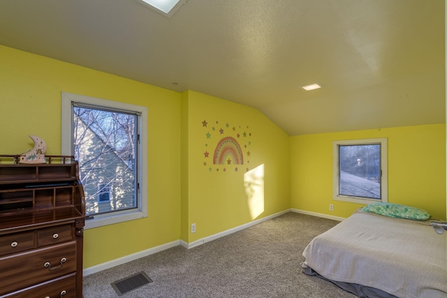 bedroom with carpet and lofted ceiling