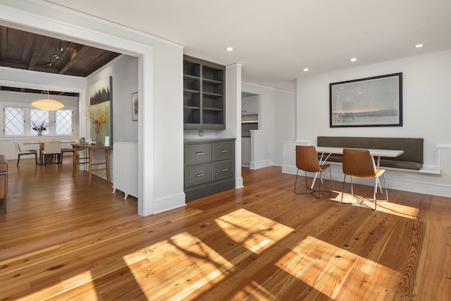 interior space featuring hardwood / wood-style flooring, baseboards, and recessed lighting