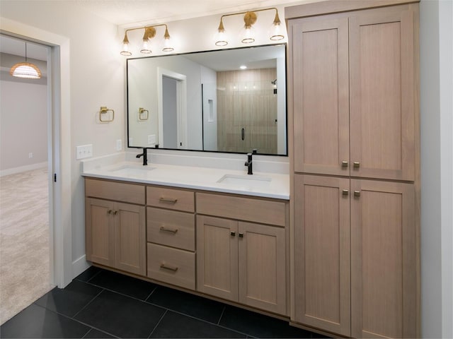 bathroom with tile patterned flooring, vanity, and a shower with door