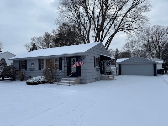 view of front of property featuring a garage and an outdoor structure