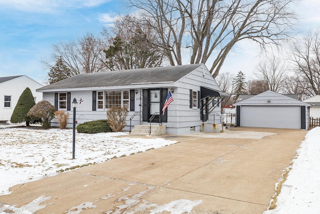 view of front of house featuring an outbuilding and a garage