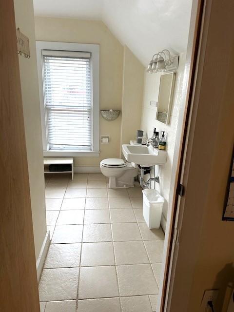 1635 Delano Ave, Maple Plain, MN 55359 - bathroom featuring lofted ceiling and tile patterned floors