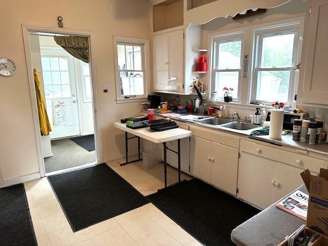 1635 Delano Ave, Maple Plain, MN 55359 - kitchen with light countertops and white cabinets