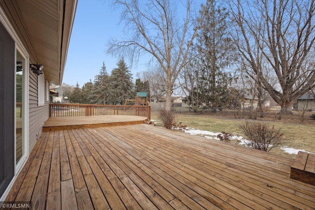 wooden terrace featuring a playground