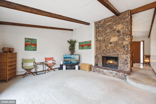 carpeted living room featuring a stone fireplace and beamed ceiling