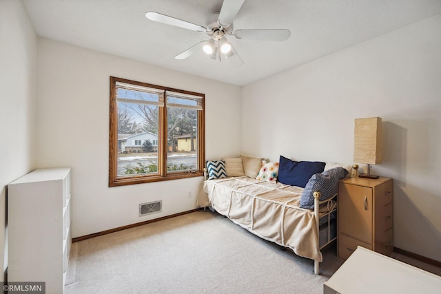 bedroom with ceiling fan and carpet floors