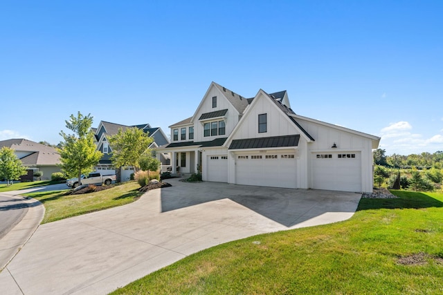 view of front of property with a garage and a front lawn