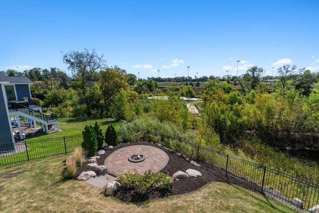 view of yard featuring a patio and a fire pit