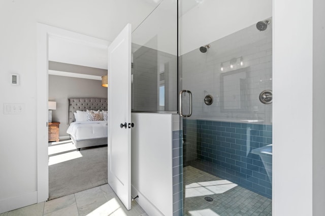 bathroom featuring tile patterned flooring and an enclosed shower