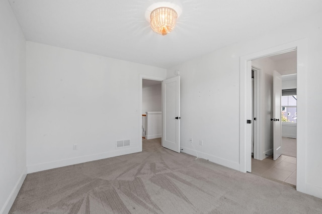 unfurnished bedroom with light carpet