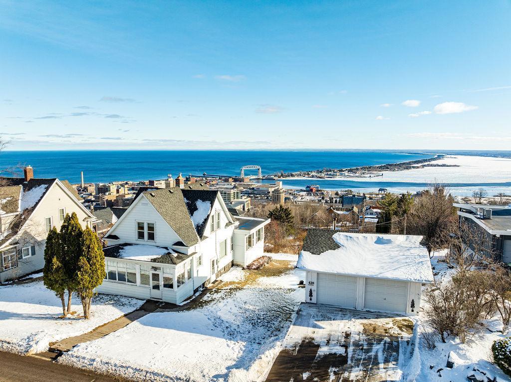 birds eye view of property featuring a water view