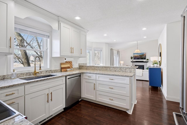 kitchen with dark wood-type flooring, dishwasher, a peninsula, white cabinetry, and a sink