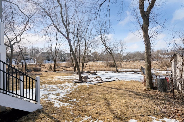 view of yard layered in snow