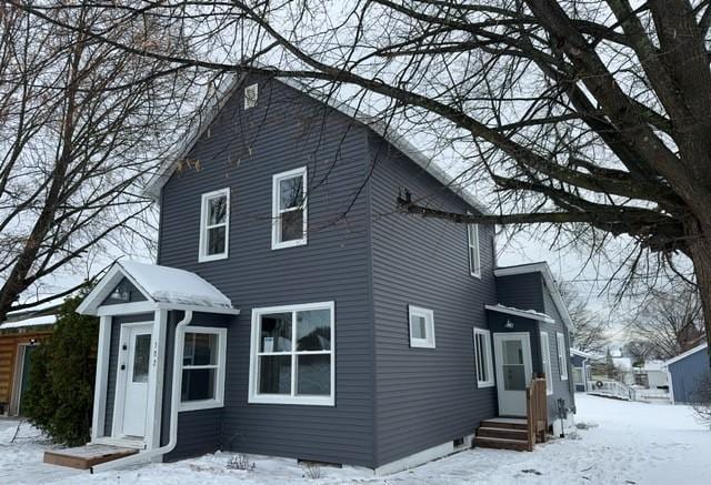 view of snow covered house