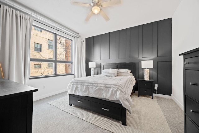 bedroom with ceiling fan and light colored carpet