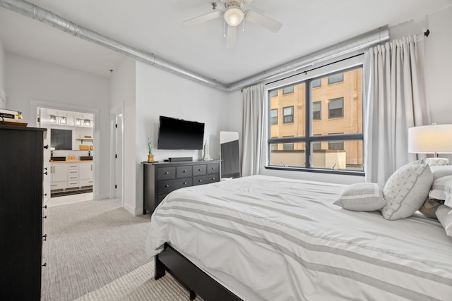 bedroom featuring ensuite bathroom, ceiling fan, and light colored carpet