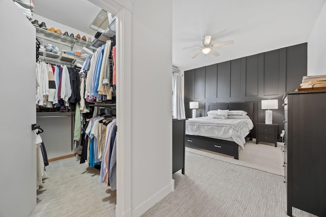 carpeted bedroom featuring a closet and ceiling fan