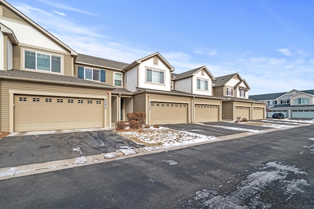 townhome / multi-family property featuring a garage