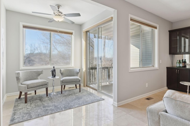 sitting room with ceiling fan