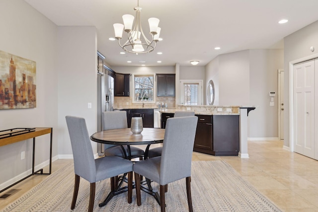 dining space with a chandelier