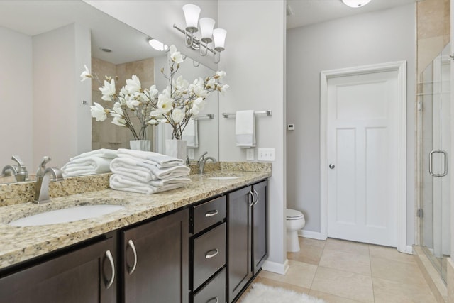 bathroom with toilet, tile patterned floors, an enclosed shower, and vanity