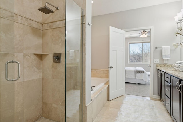 bathroom with ceiling fan, vanity, tile patterned floors, and independent shower and bath